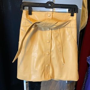 Urban Outfitters yellow faux leather mini skirt